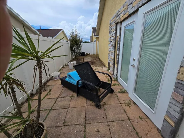 a backyard of a house with seating space