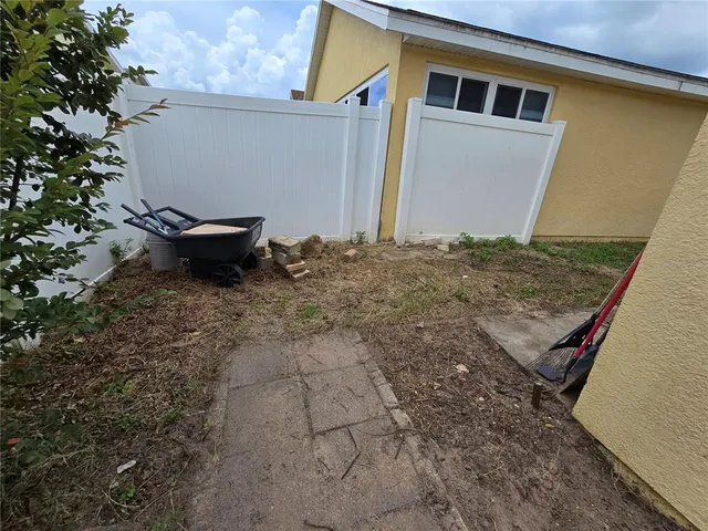 a house view with a backyard space