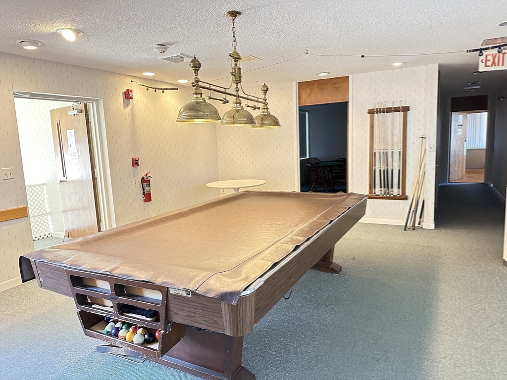 1004 Paradise Road, Unit 1K Swampscott, MA 01907 - Photo 30 of 37 a room with pool table and a window