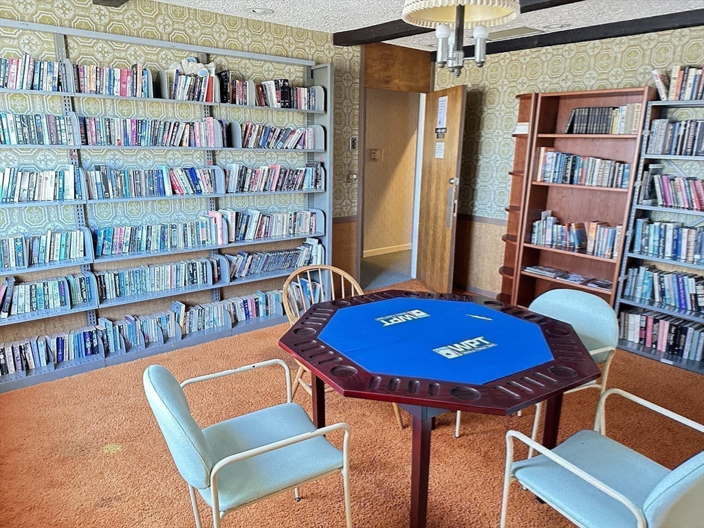 1004 Paradise Road, Unit 1K Swampscott, MA 01907 - Photo 31 of 37 a view of a livingroom with furniture and staircase