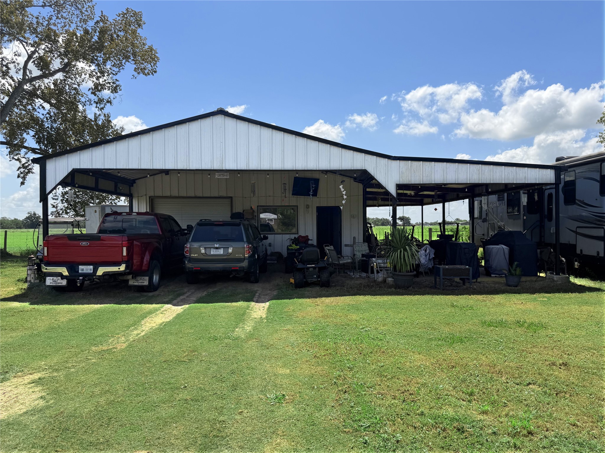 3320 Cr 135 Road Wharton, TX 77488 - Photo 1 of 7 Front view of large covered carport/shop building with RV bay