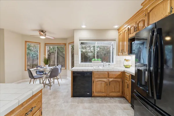 a kitchen with a sink stove and refrigerator