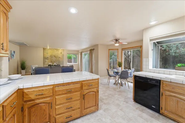 a kitchen with kitchen island granite countertop a sink and counter space