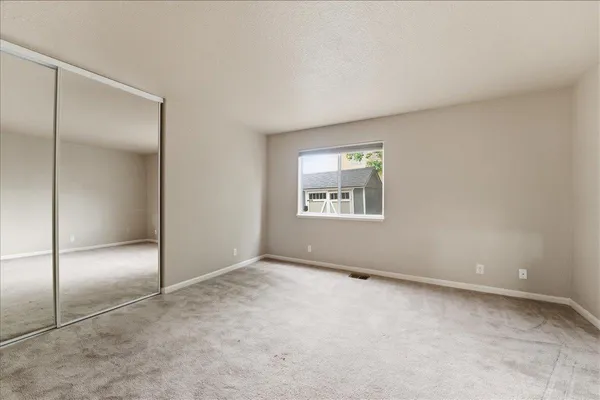 an empty room with a mirror