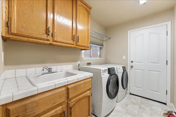 a utility room with dryer and washer