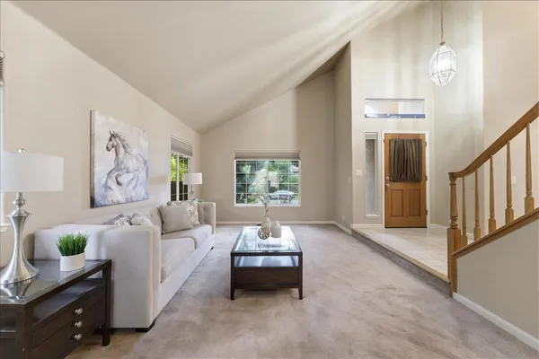 a living room with furniture and a window