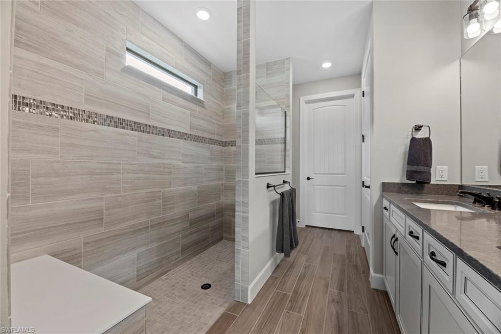 a bathroom with a sink and a shower