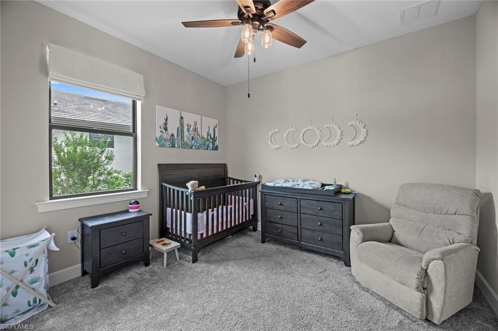 19648 Beechcrest Place Estero, FL 33928 - Photo 14 of 34 a bedroom with furniture and a window