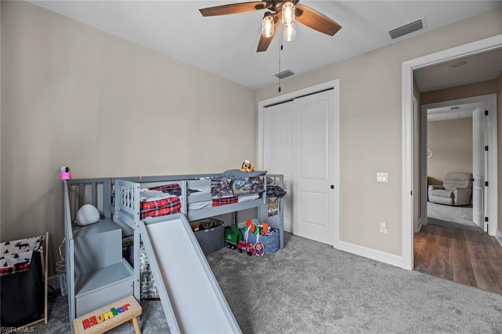 19648 Beechcrest Place Estero, FL 33928 - Photo 18 of 34 a view of gym equipment and children play room