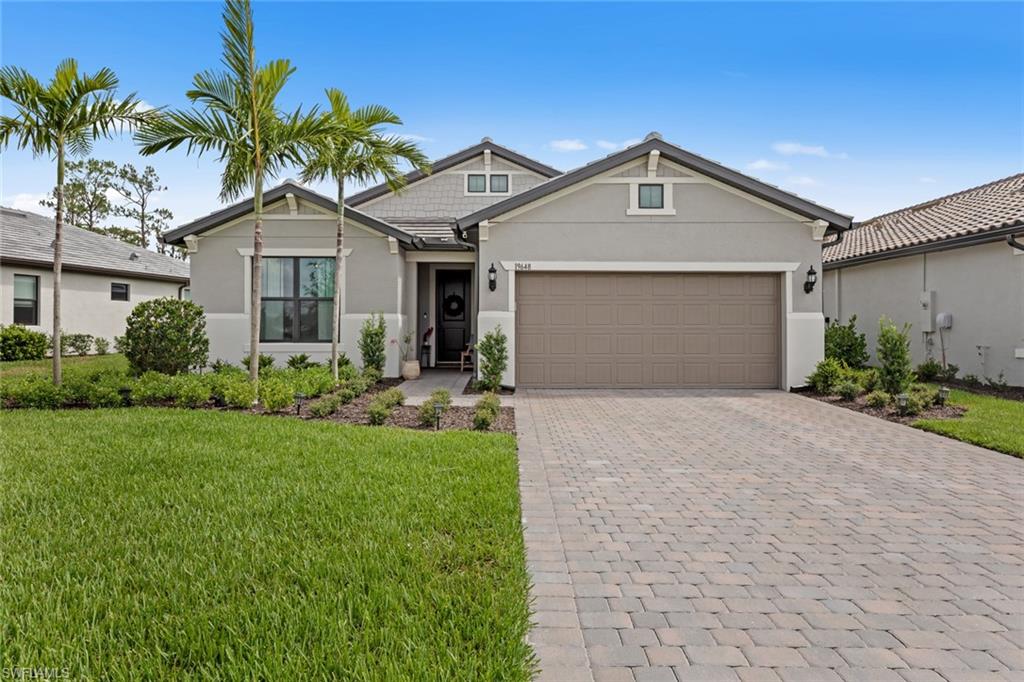19648 Beechcrest Place Estero, FL 33928 - Photo 2 of 34 a front view of house with yard and green space