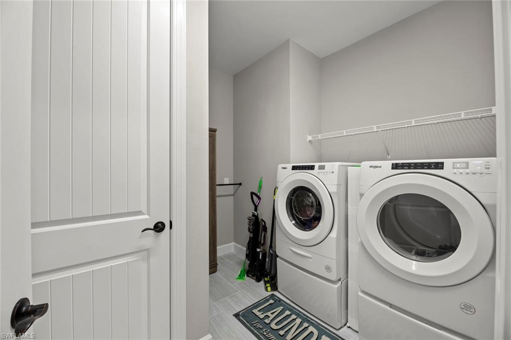 19648 Beechcrest Place Estero, FL 33928 - Photo 21 of 34 a utility room with dryer and washer