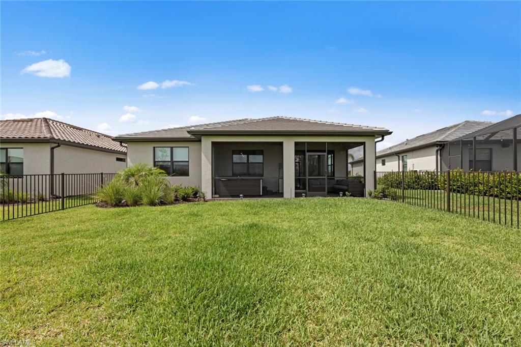 19648 Beechcrest Place Estero, FL 33928 - Photo 22 of 34 a view of a house with backyard and garden