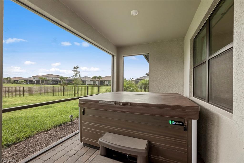 19648 Beechcrest Place Estero, FL 33928 - Photo 26 of 34 a view of a porch with furniture and garden