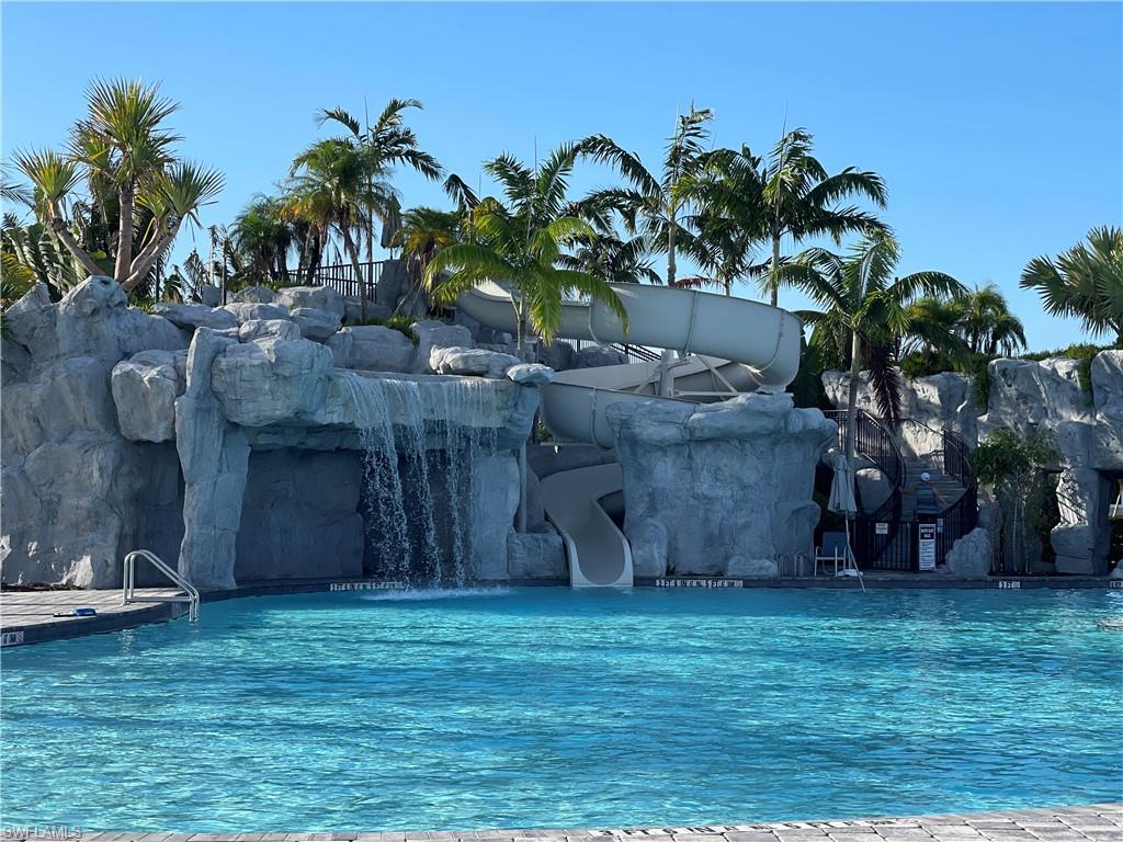 19648 Beechcrest Place Estero, FL 33928 - Photo 28 of 34 a couple of potted plants sitting in front of a house