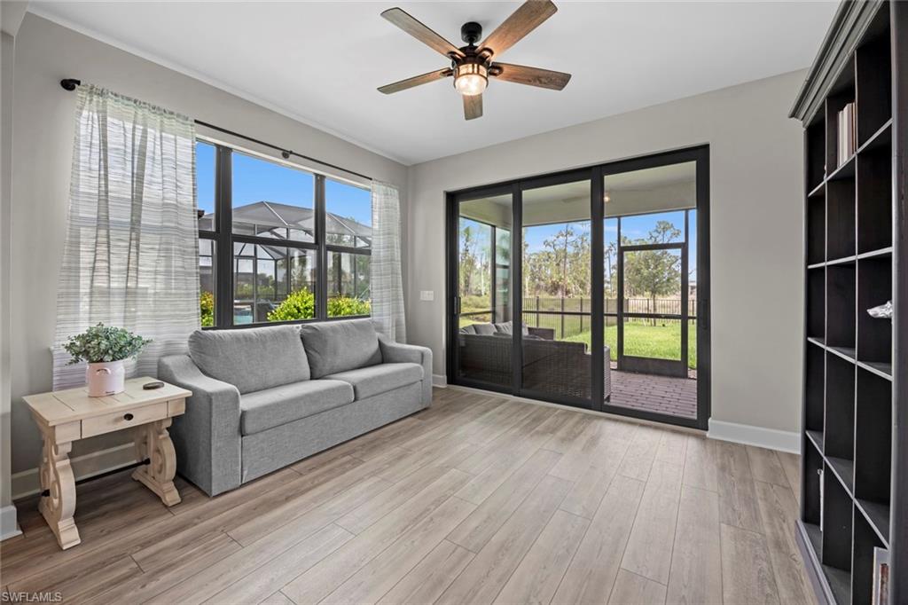 19648 Beechcrest Place Estero, FL 33928 - Photo 8 of 34 a living room with furniture and a large window