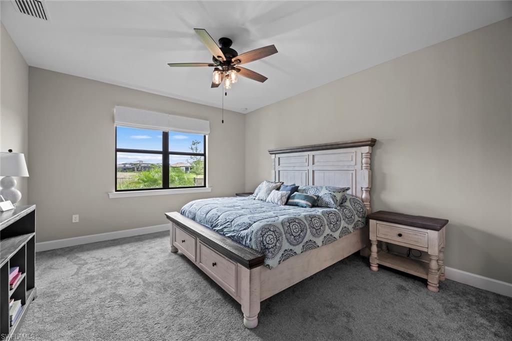 19648 Beechcrest Place Estero, FL 33928 - Photo 10 of 34 a bedroom with a bed and a window