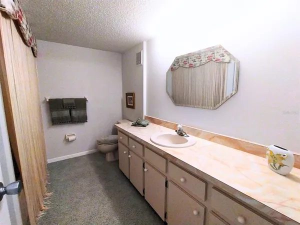 a view of a hallway with a white door
