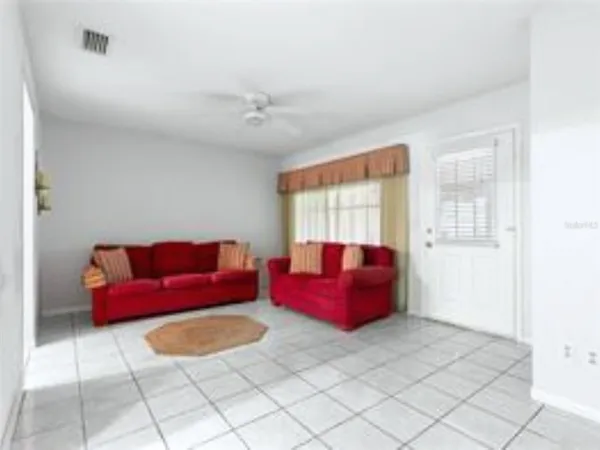 a living room with furniture and a window