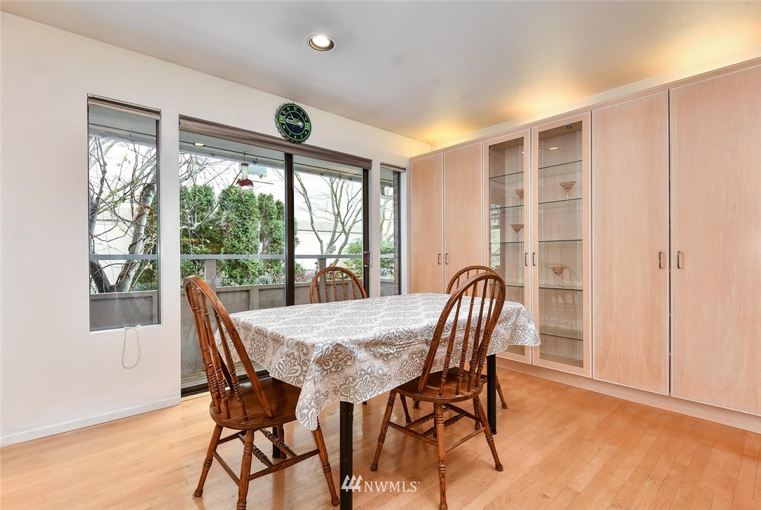 623 Main Street, Unit 3 Edmonds, WA 98020 - Photo 6 of 10 a view of a dining room with furniture window and outside view