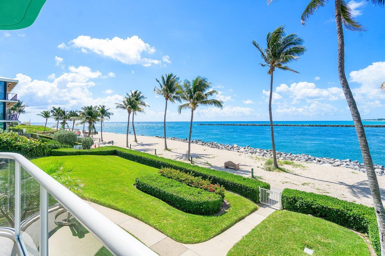 120 Inlet Way, Unit 204 Palm Beach Shores, FL 33404 - Photo 1 of 27 a view of a backyard with a garden