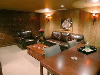 a living room with couches and a flat screen tv