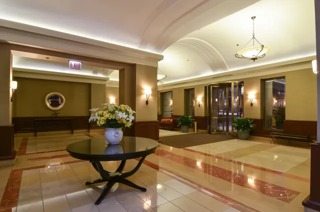 a lobby with table and chairs