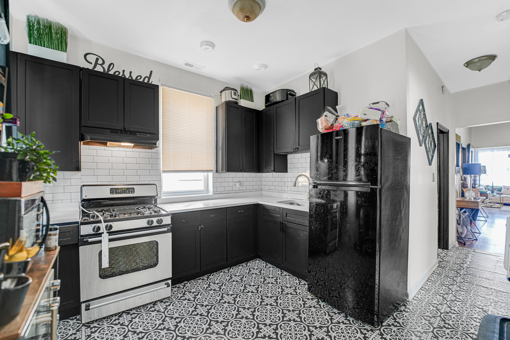 7222 South Rhodes Avenue Chicago, IL 60619 - Photo 11 of 22 a kitchen with a refrigerator and a sink