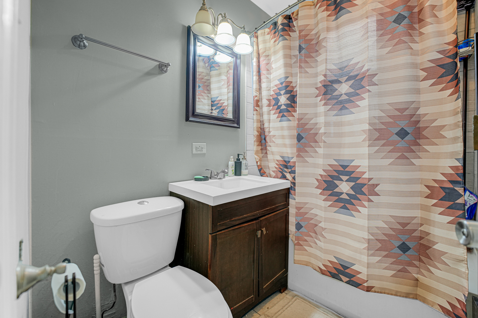 7222 South Rhodes Avenue Chicago, IL 60619 - Photo 19 of 22 a bathroom with a sink toilet and shower