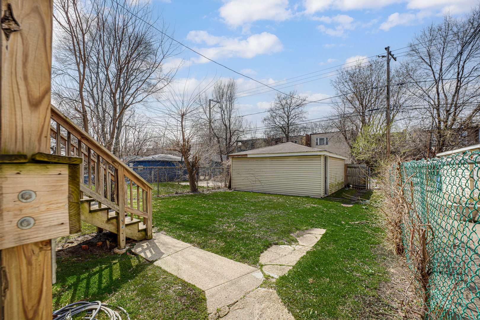 7222 South Rhodes Avenue Chicago, IL 60619 - Photo 21 of 22 a view of a house with a yard