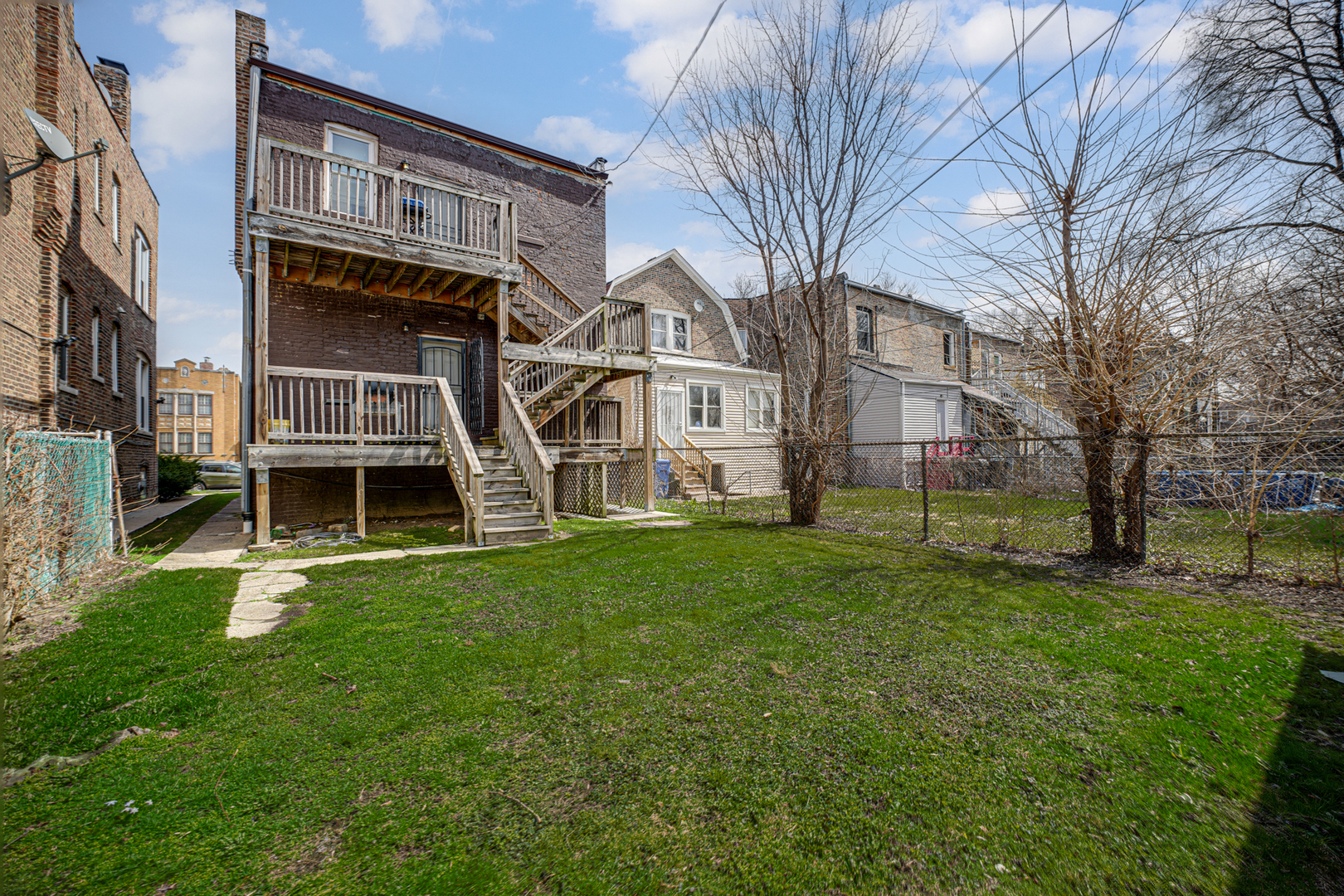 7222 South Rhodes Avenue Chicago, IL 60619 - Photo 22 of 22 a view of a house with a yard