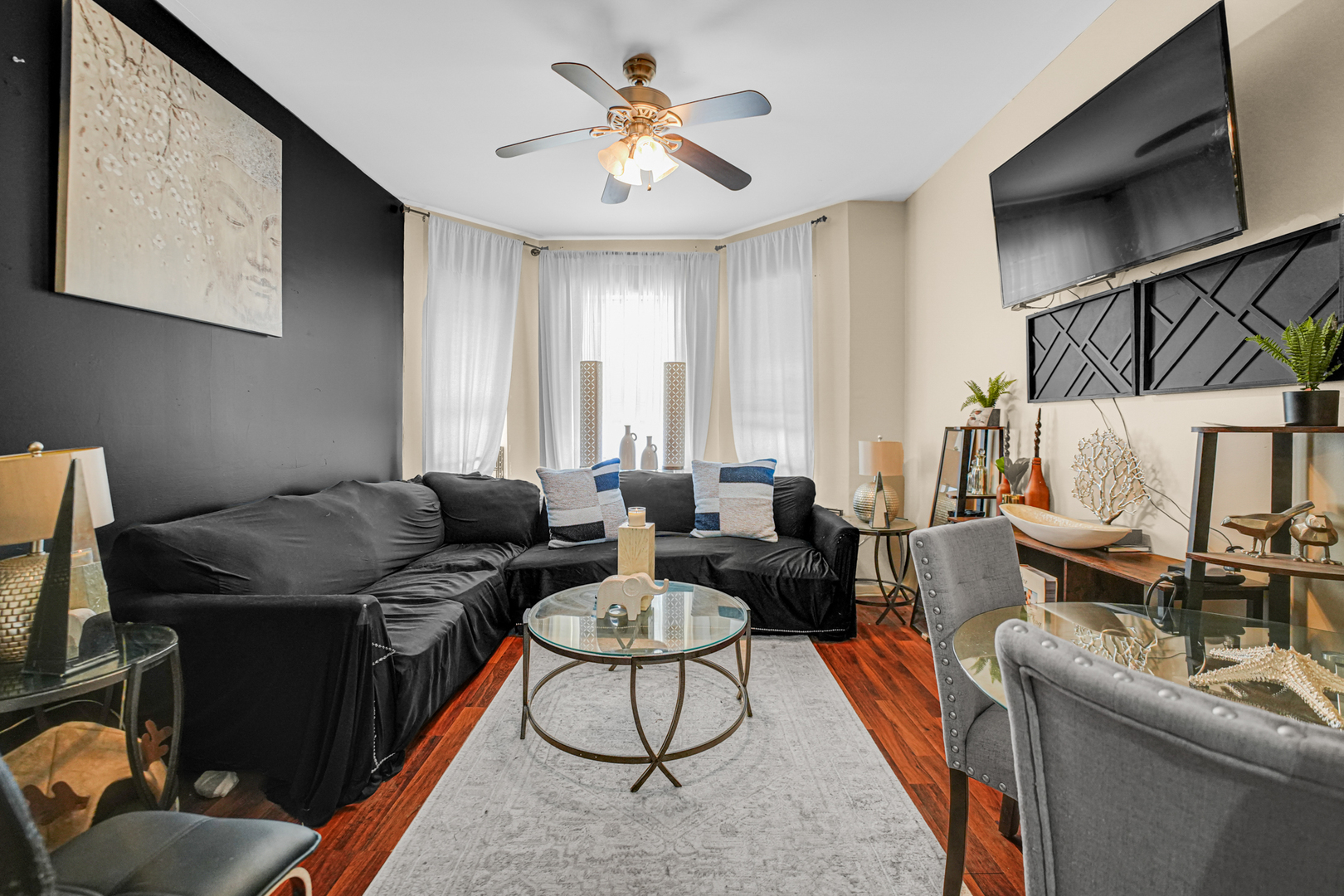 7222 South Rhodes Avenue Chicago, IL 60619 - Photo 4 of 22 a living room with furniture fireplace and a flat screen tv