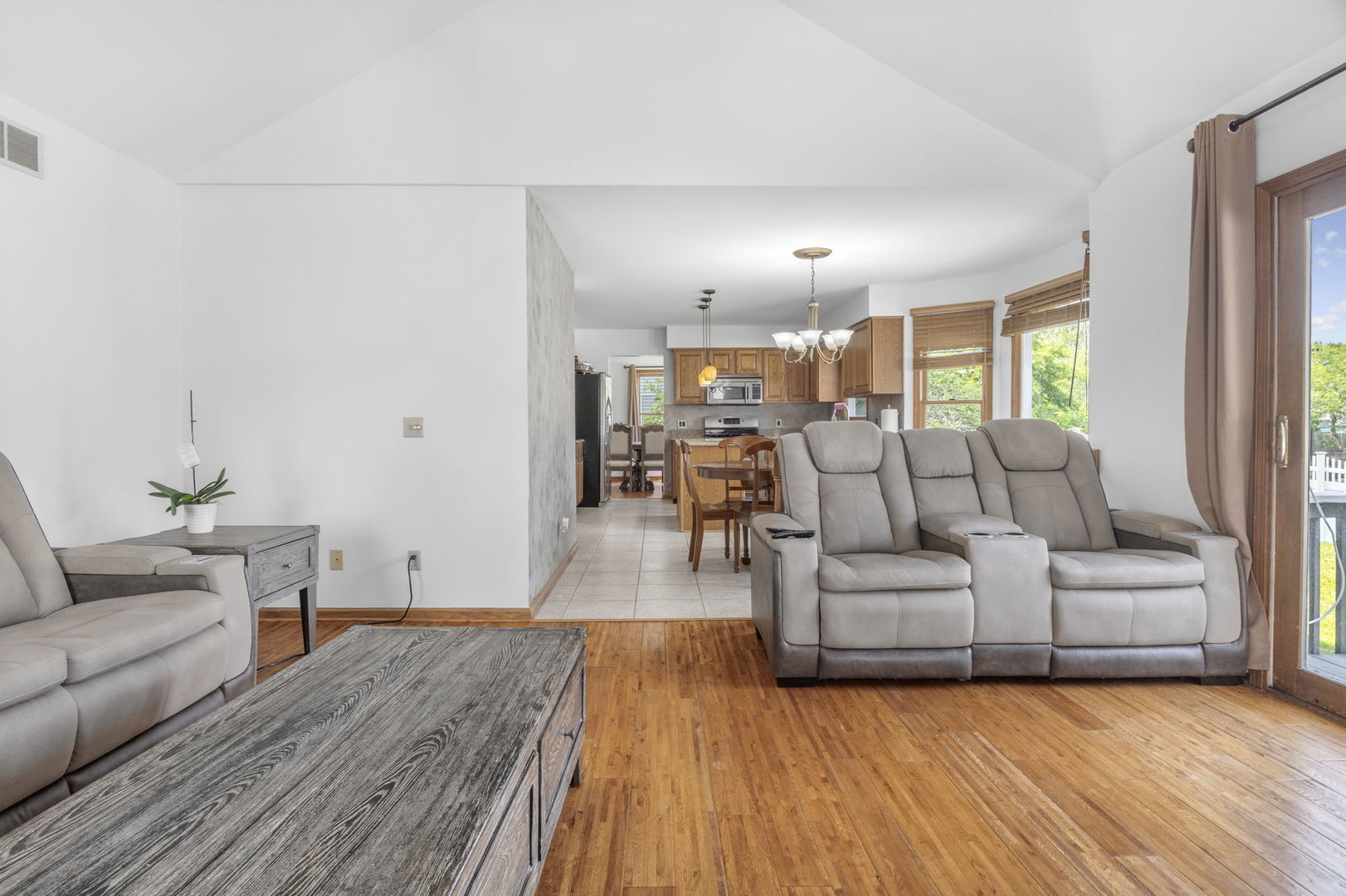 5207 Sunmeadow Drive Plainfield, IL 60586 - Photo 13 of 32 a living room with furniture and a wooden floor