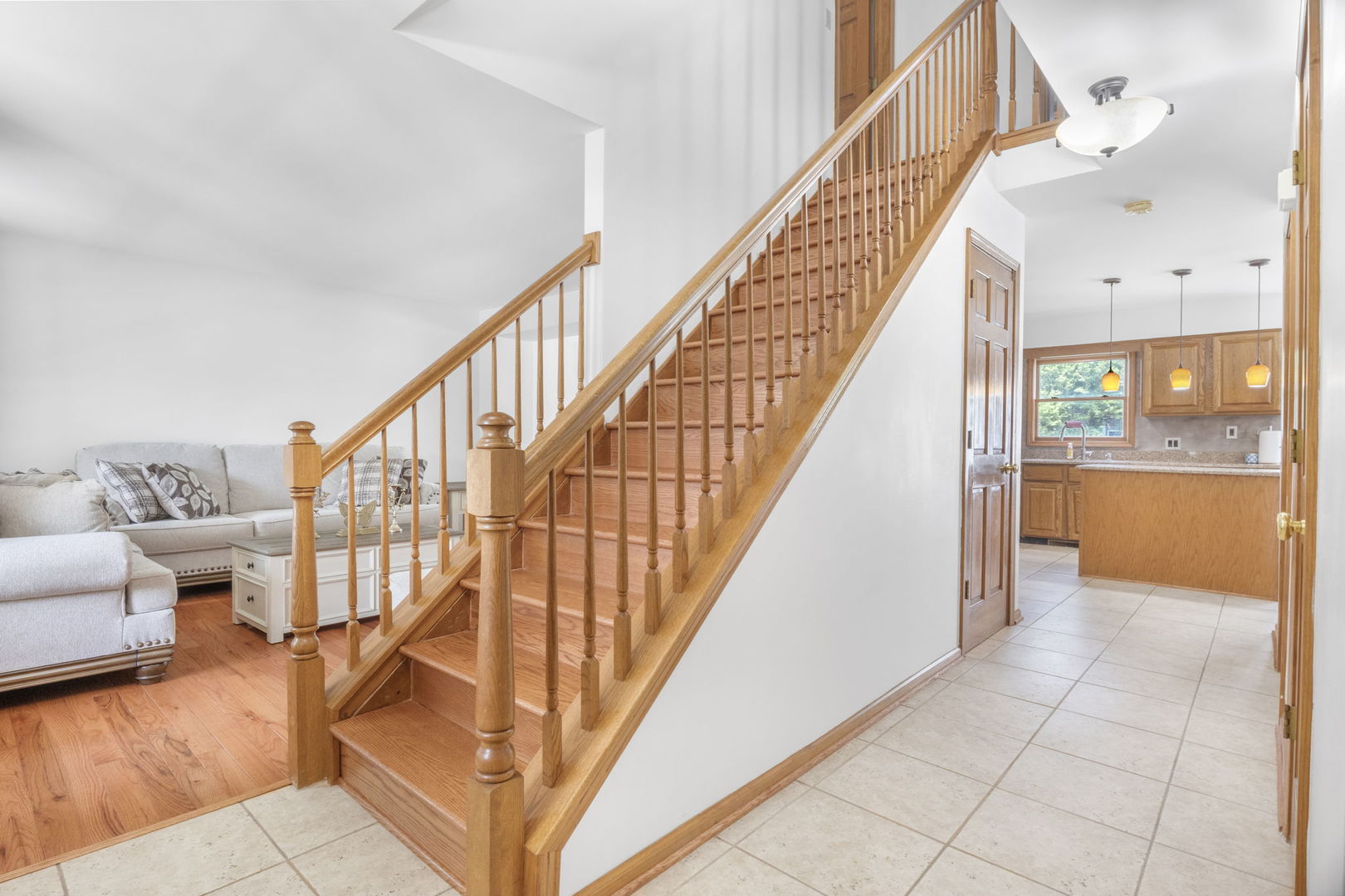 5207 Sunmeadow Drive Plainfield, IL 60586 - Photo 16 of 32 a view of entryway and hall with wooden floor