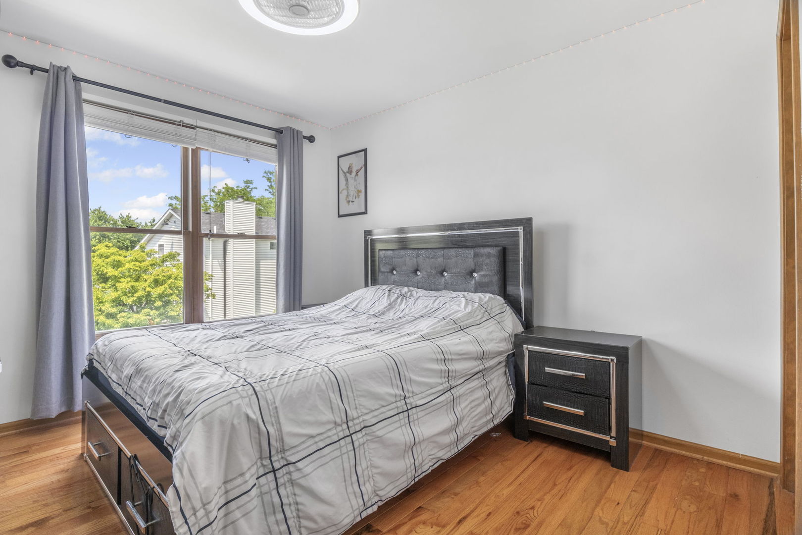 5207 Sunmeadow Drive Plainfield, IL 60586 - Photo 17 of 32 a bed sitting in a bedroom next to a window