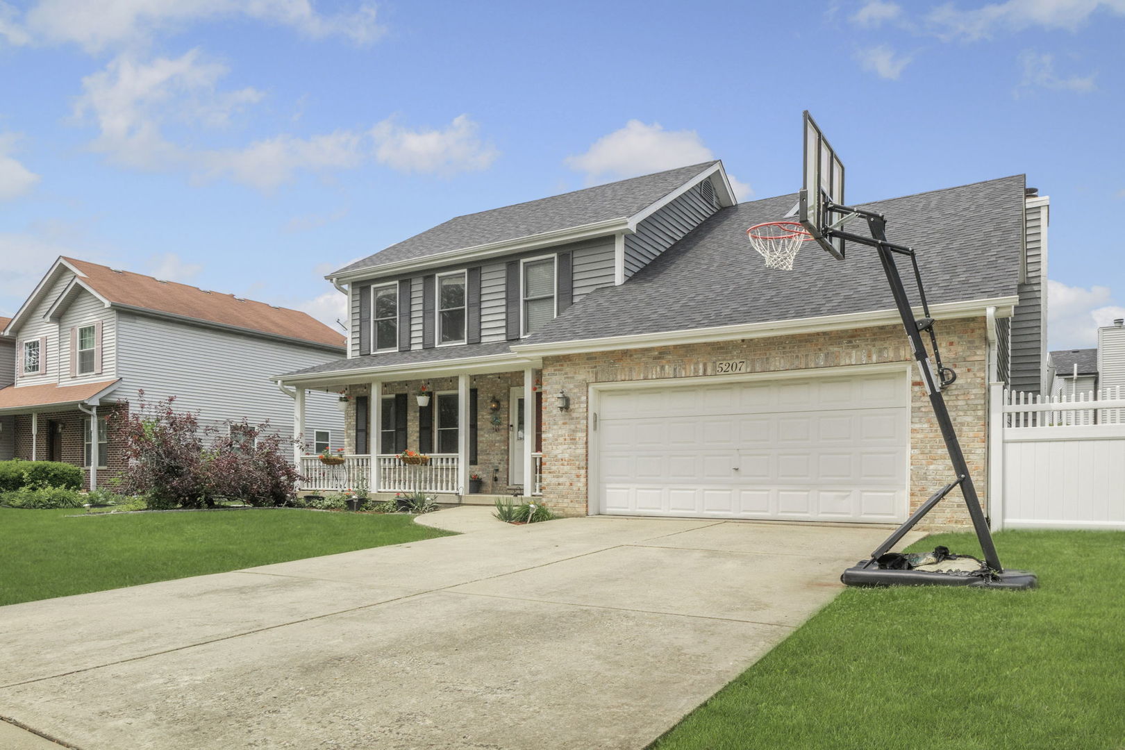 5207 Sunmeadow Drive Plainfield, IL 60586 - Photo 4 of 32 a front view of a house with a yard