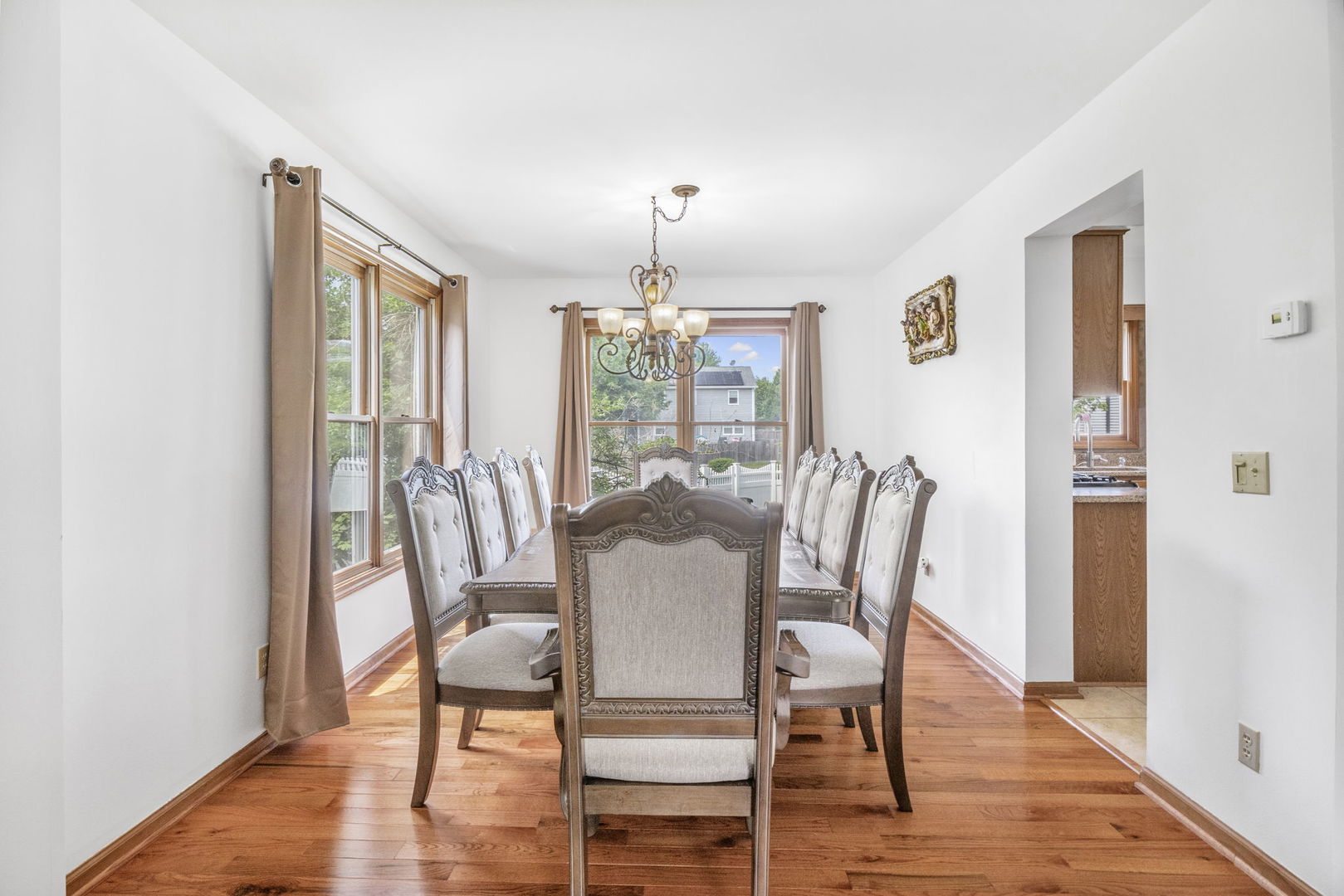 5207 Sunmeadow Drive Plainfield, IL 60586 - Photo 7 of 32 a dining room with furniture window and wooden floor