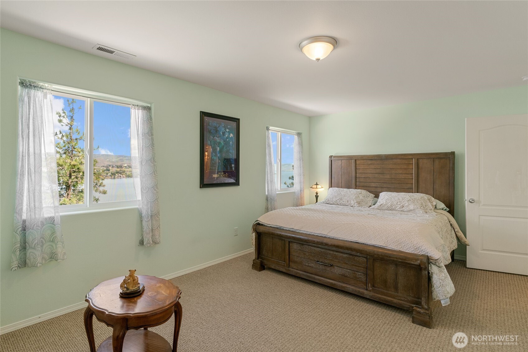 165 Granite Falls Road Chelan, WA 98816 - Photo 16 of 27 a bedroom with a bed and a chair