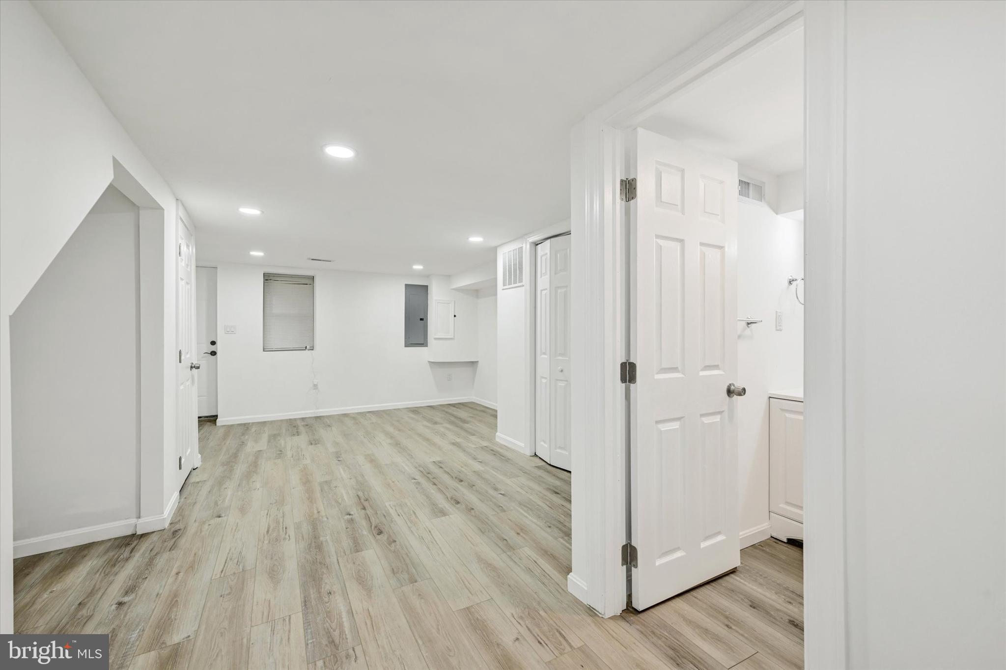 1604 Carswell Street Baltimore, MD 21218 - Photo 11 of 14 a view of a hallway with wooden floor