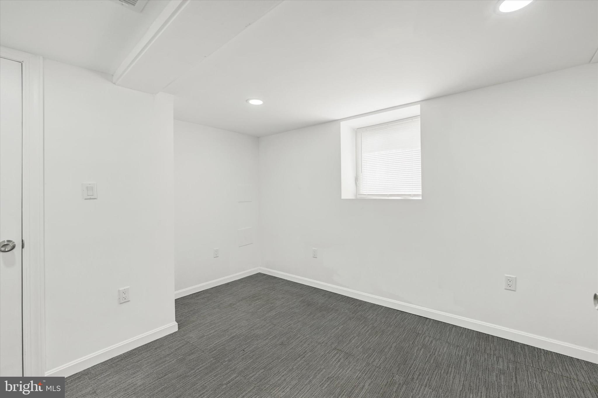 1604 Carswell Street Baltimore, MD 21218 - Photo 12 of 14 an empty room with a window