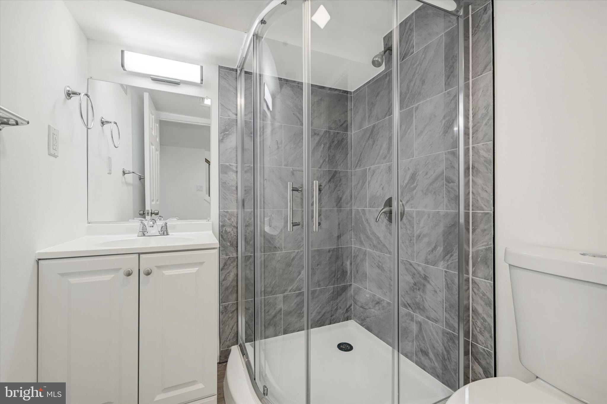 1604 Carswell Street Baltimore, MD 21218 - Photo 13 of 14 a bathroom with a shower and a sink