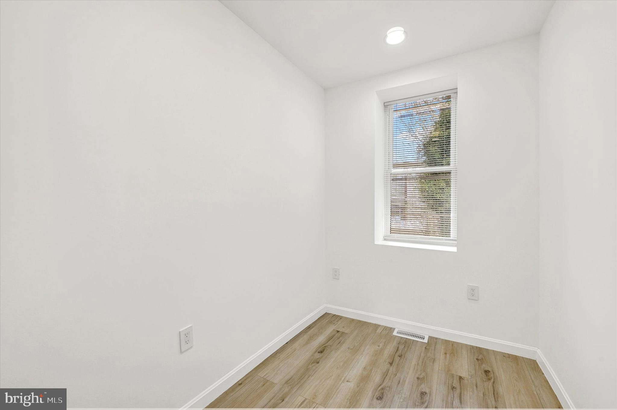 1604 Carswell Street Baltimore, MD 21218 - Photo 7 of 14 an empty room with a window