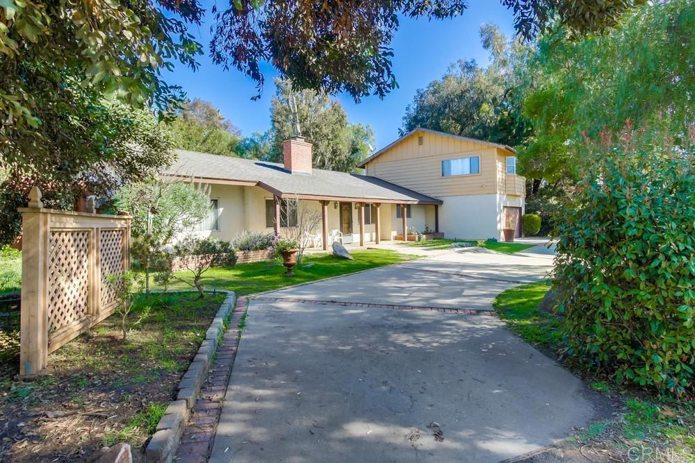 552 Cassou Road San Marcos, CA 92069 - Photo 1 of 1 a front view of a house with garden