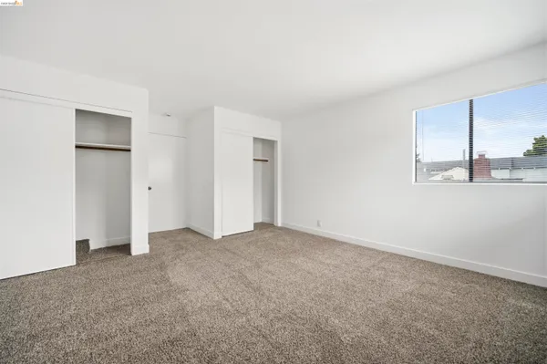 an empty room with a bathroom