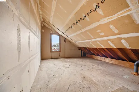 a view of an empty room with stairs