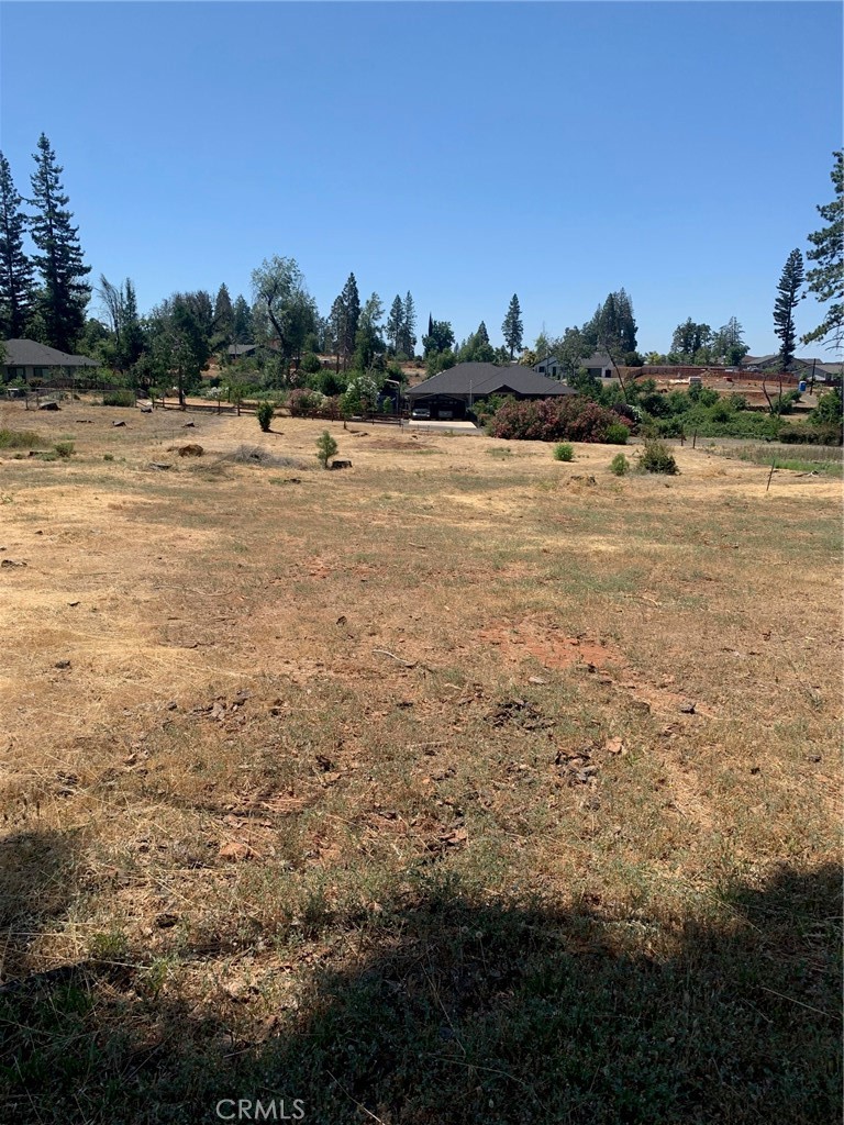 a view of a lake with houses in the background