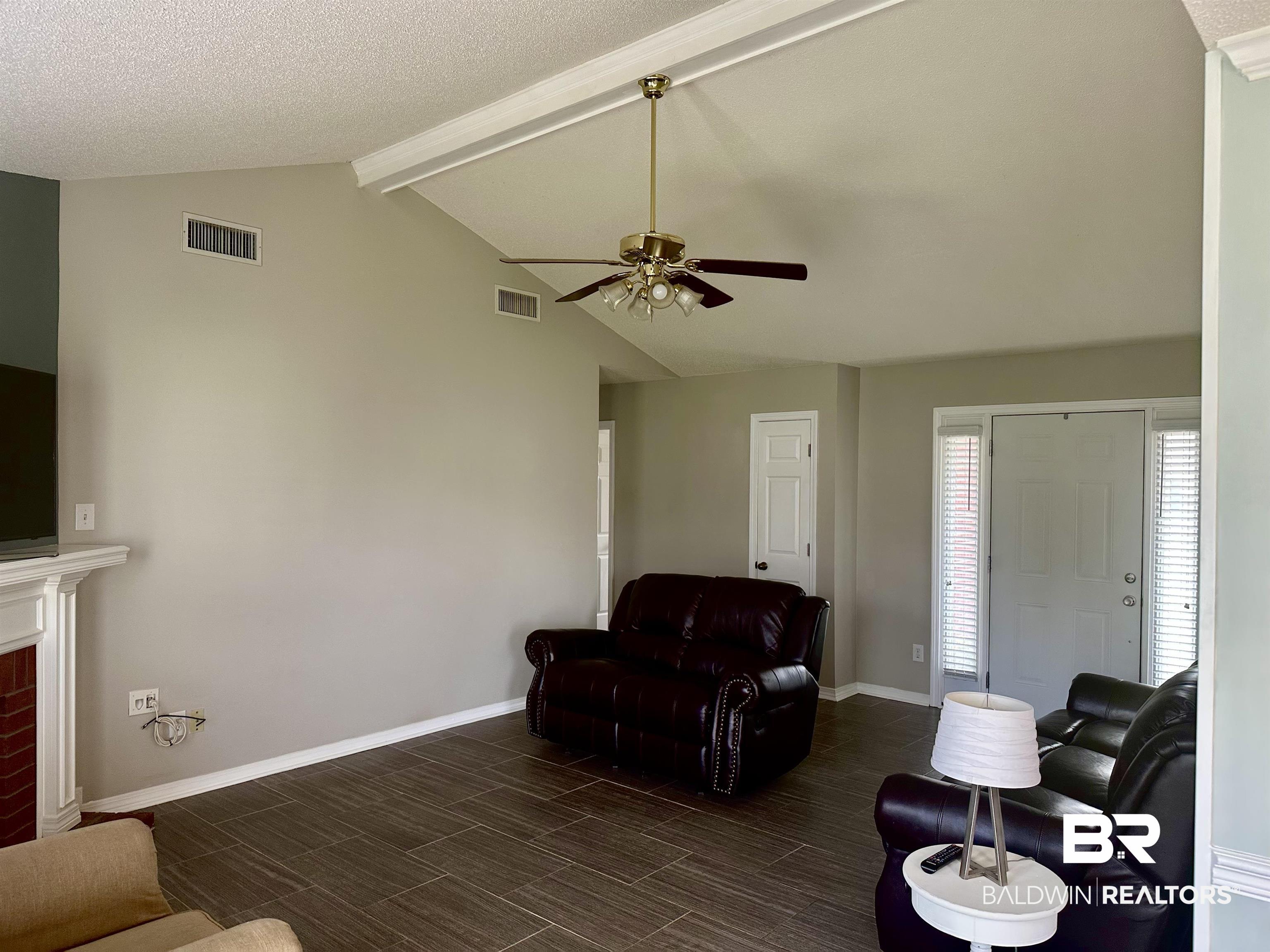 4882 Rebecca Place Mobile, AL 36695 - Photo 24 of 29 Living room featuring lofted ceiling with beams, baseboards, visible vents, and ceiling fan