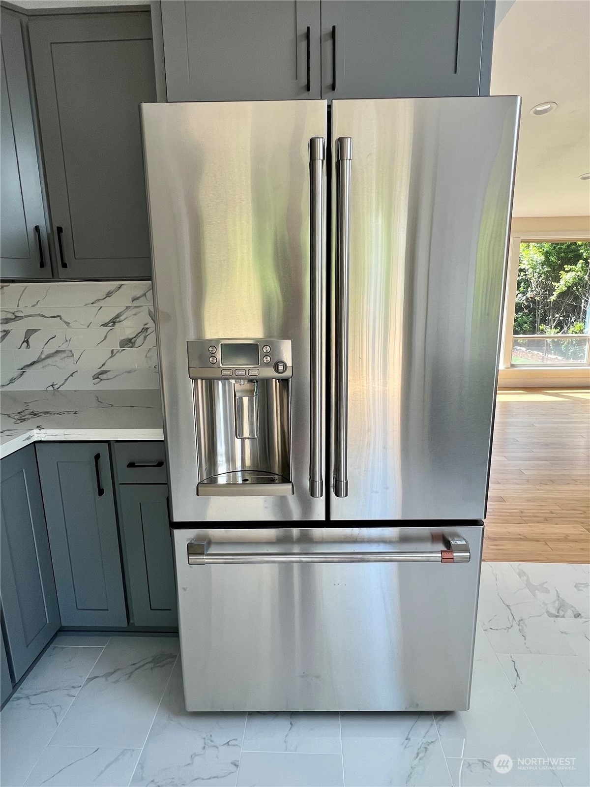 22925 49th Avenue Southeast Bothell, WA 98021 - Photo 12 of 40 a view of a refrigerator with wooden floor