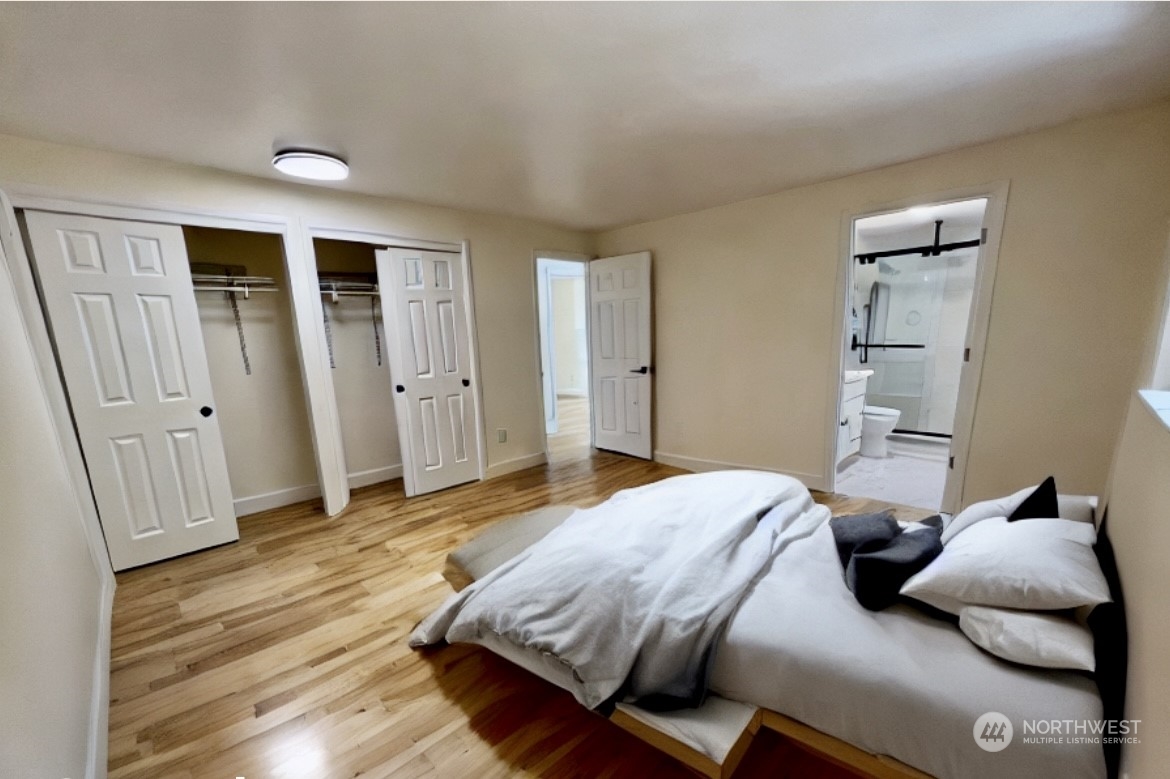 22925 49th Avenue Southeast Bothell, WA 98021 - Photo 15 of 40 a bedroom with a bed and wooden floor