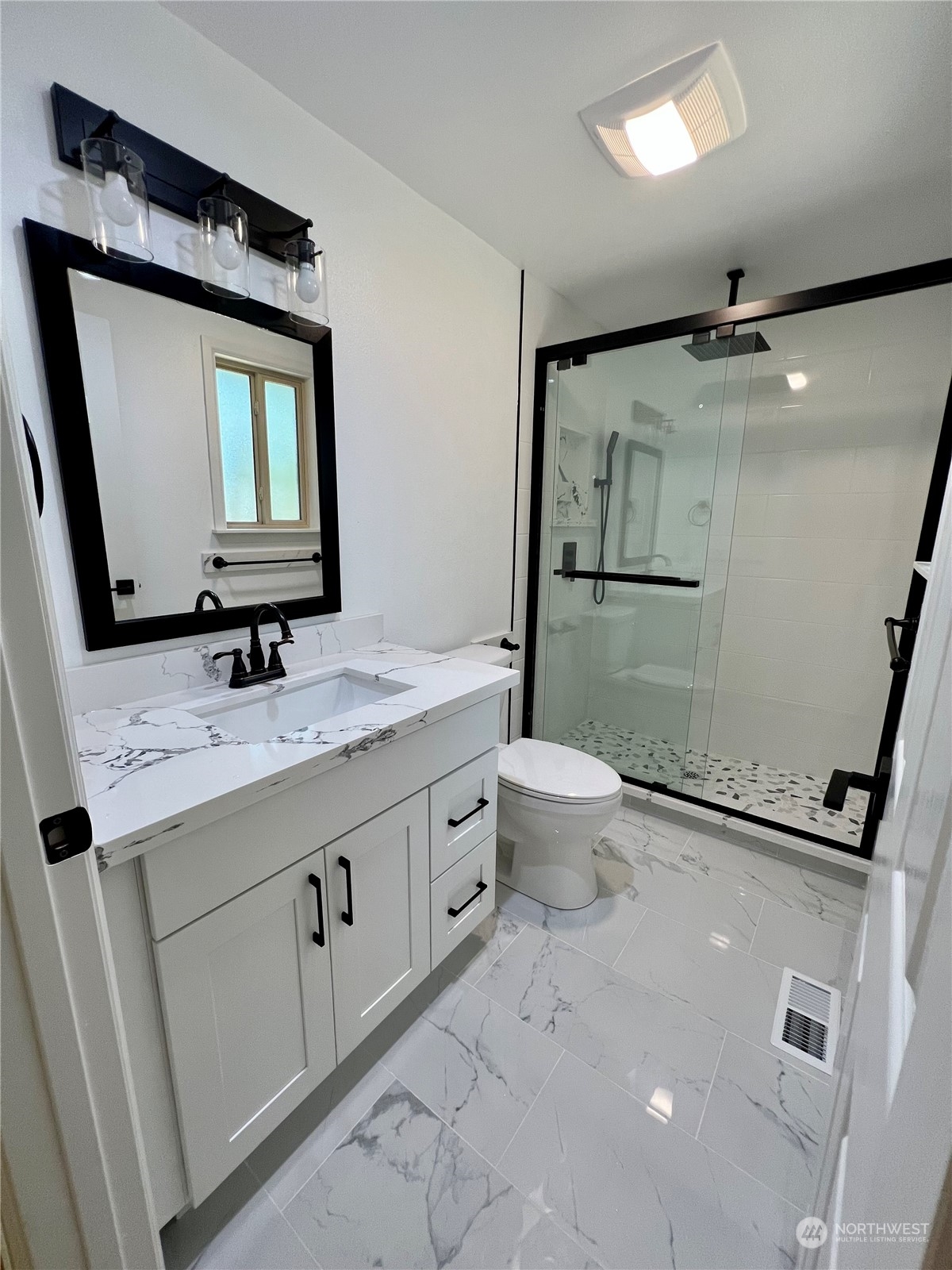 22925 49th Avenue Southeast Bothell, WA 98021 - Photo 17 of 40 a bathroom with a granite countertop sink mirror vanity and toilet