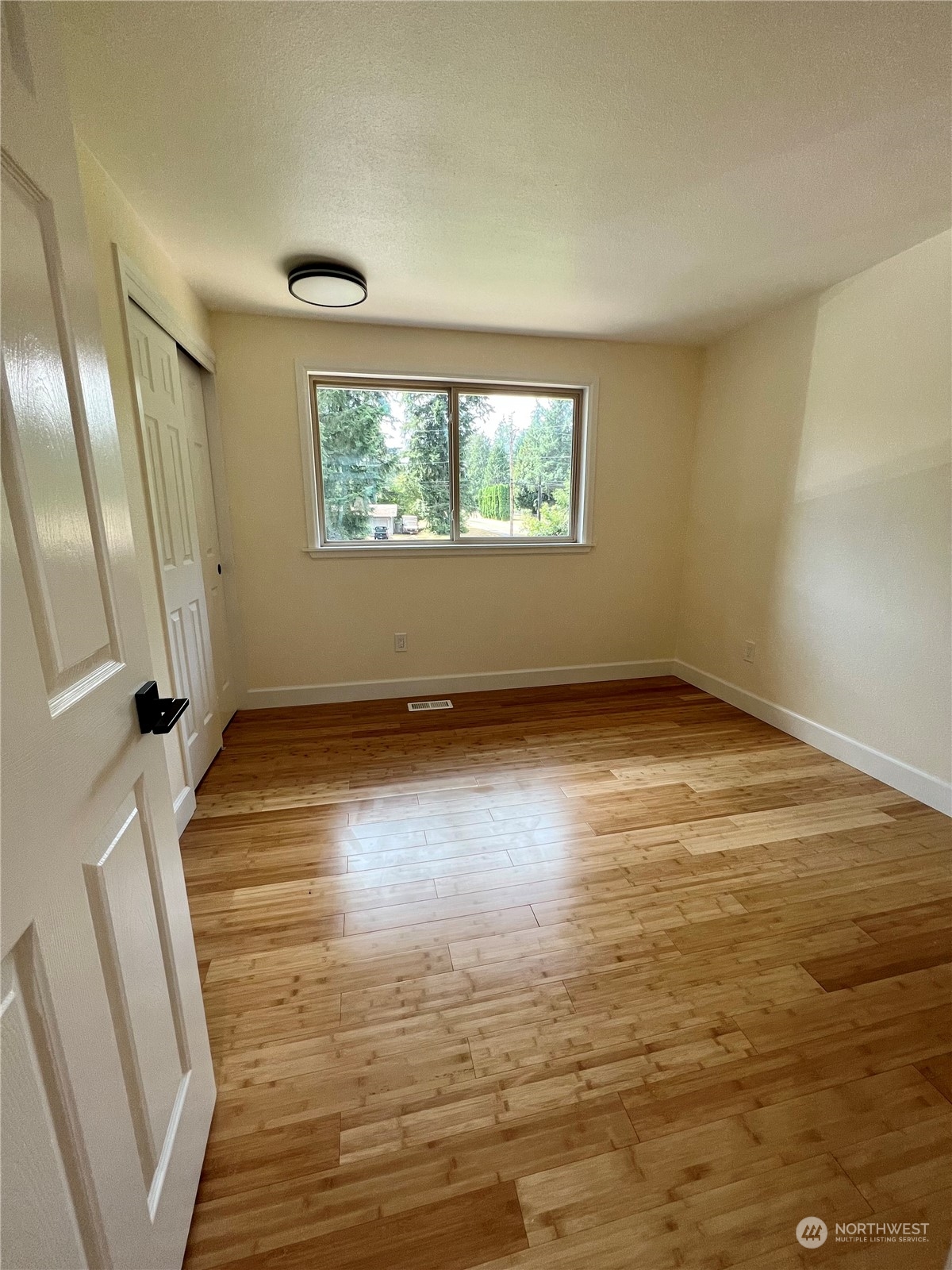 22925 49th Avenue Southeast Bothell, WA 98021 - Photo 20 of 40 a view of empty room with wooden floor and fan